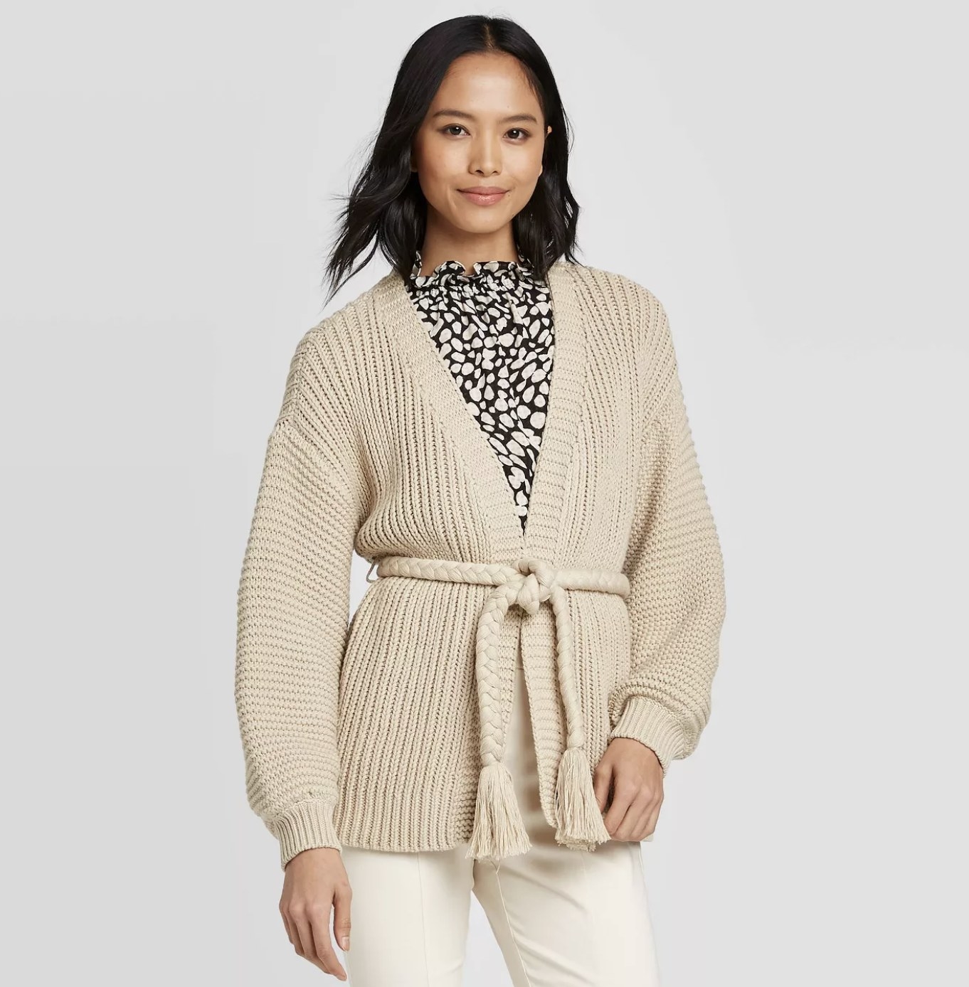 model wearing sleeved cardigan with rope tie waist
