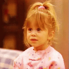 Michelle Tanner from Full House blowing a kiss 