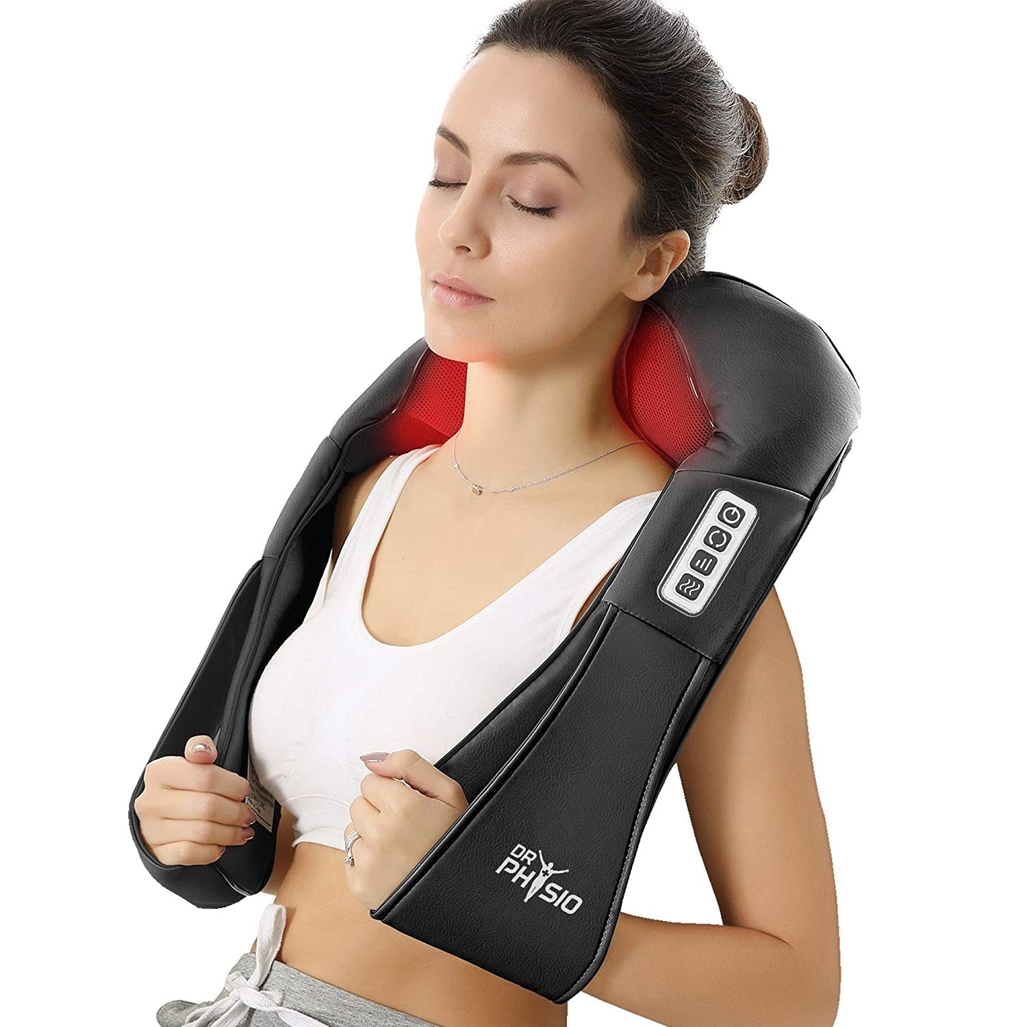 A woman using the massager on her shoulder