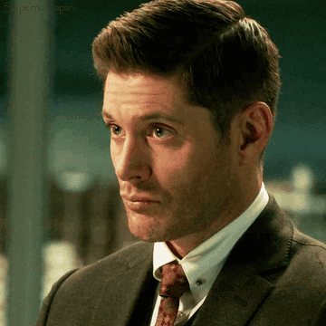 A gif of Dean (as Michael) shrugging and then grinning.