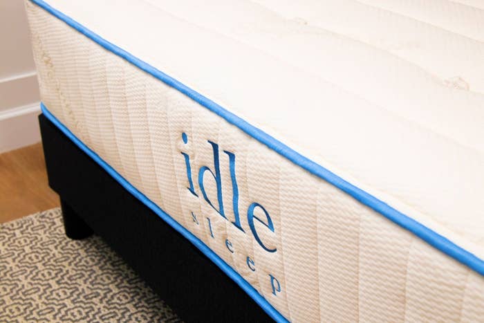 Idle Sleep branded mattress up close with blue trim