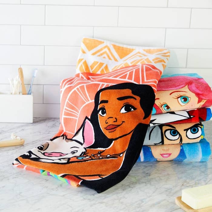 The towel, featuring a large and colorful Moana design 