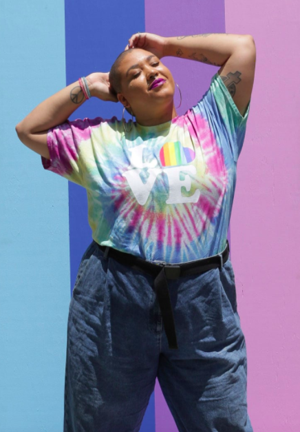 Model wears rainbow tie-dye T-shirt that says &quot;Love&quot; on the front