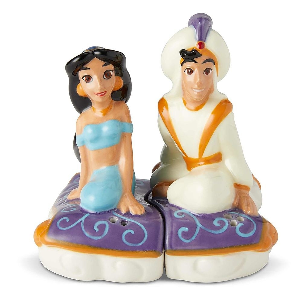 The ceramic shakers, featuring the two sculpted characters seated on magic carpet