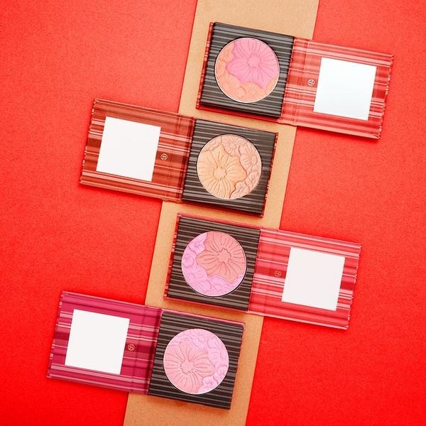 The square compacts in four shade combinations, each of which has two shades of blush with a floral imprint on it and a small mirror