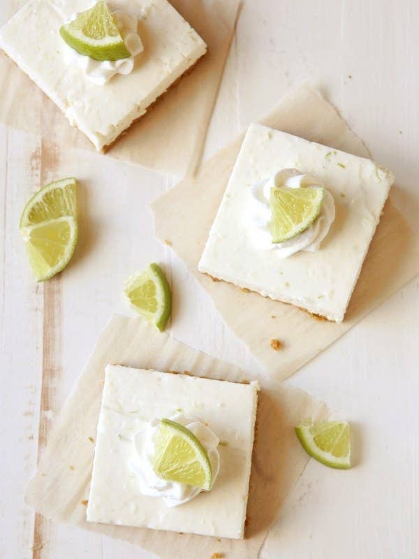 Lime cheesecake bars with real lime wedges on top