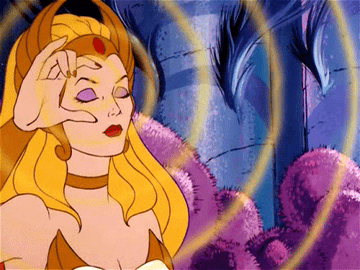 She-Ra holds her hand to her head as she uses her telepathy