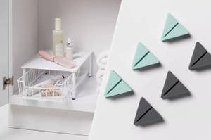 to the left: a white pull out drawer for the bathroom, to the right: mint green and grey cord holders