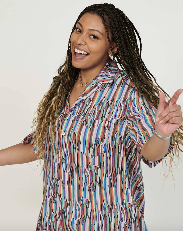 Model wearing the rainbow printed shirt