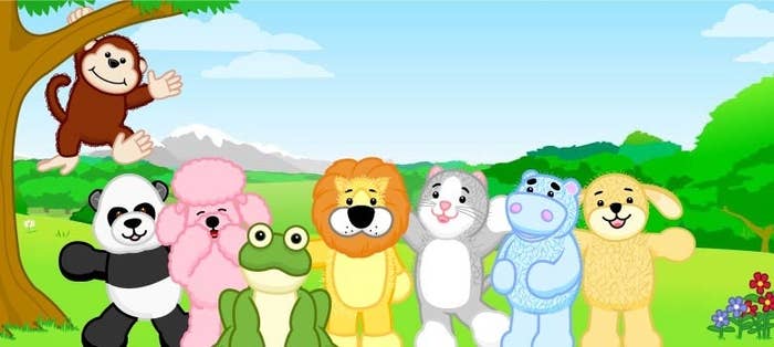 A monkey, panda, poodle, frog, lion, cat, hippo, and dog Webkinz stand outside in a field smiling at the camera