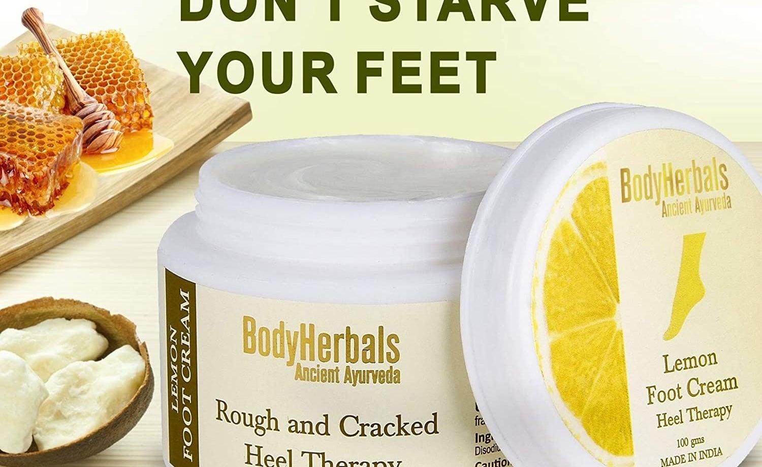 An open jar of foot cream next to its ingredients.