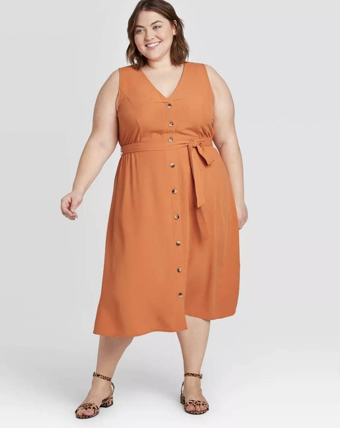 Model wearing the dress in orange 