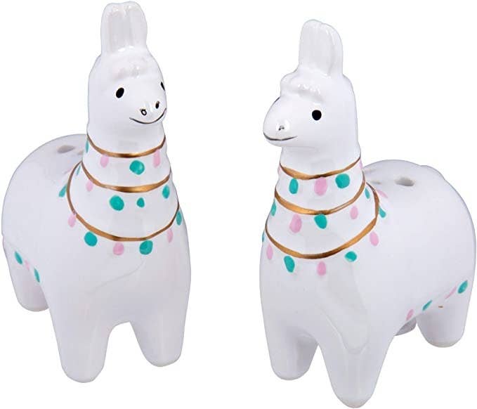 Two llamas that are salt and pepper shakers
