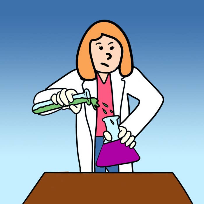 Person in a lab coat pouring liquid from a vial into a beaker