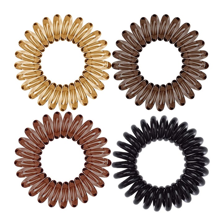 four coiled hair ties in various shades of brown