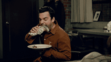 Nick from &quot;New Girl&quot; eating a burrito.