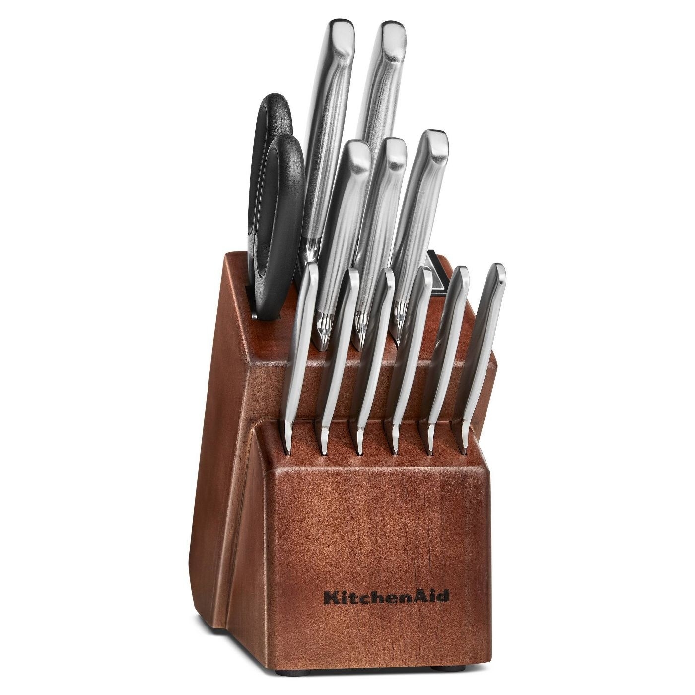silver knives in a brown wooden knife block