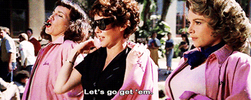 Gif of the Pink Ladies from Grease saying &quot;Let&#x27;s go get &#x27;em&quot;