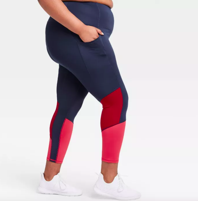 Model wears red and navy sculpted, high-rise colorblock leggings with 