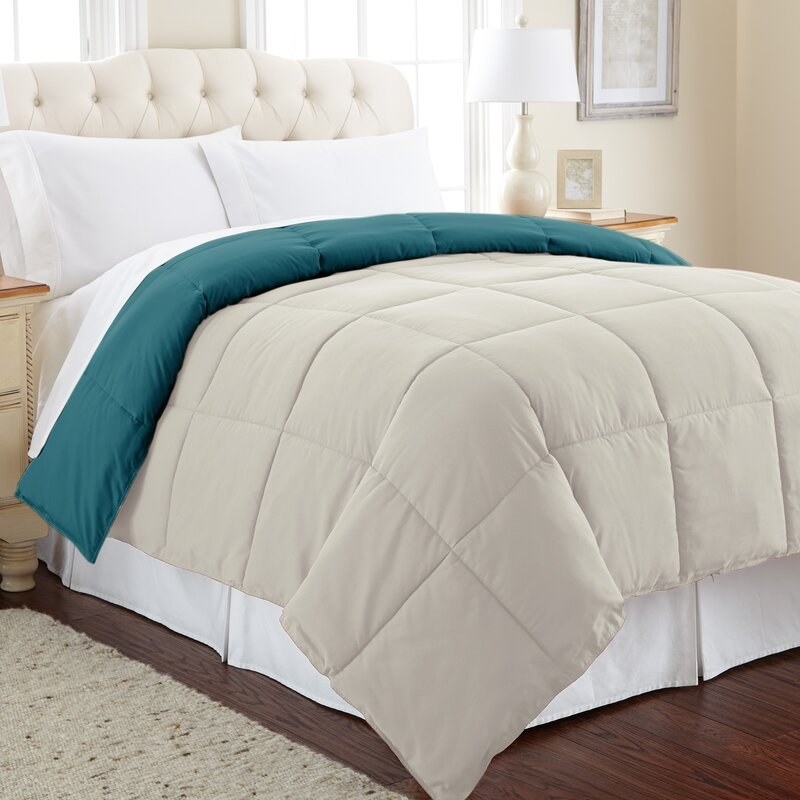 The quilted comforter in blue and oatmeal