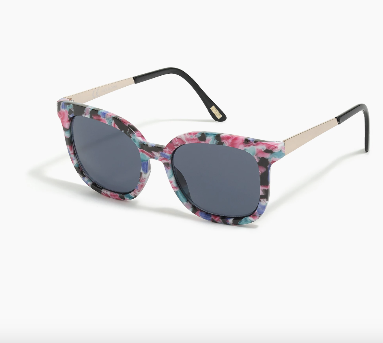the sunglasses, which are black with a floral pattern around the border
