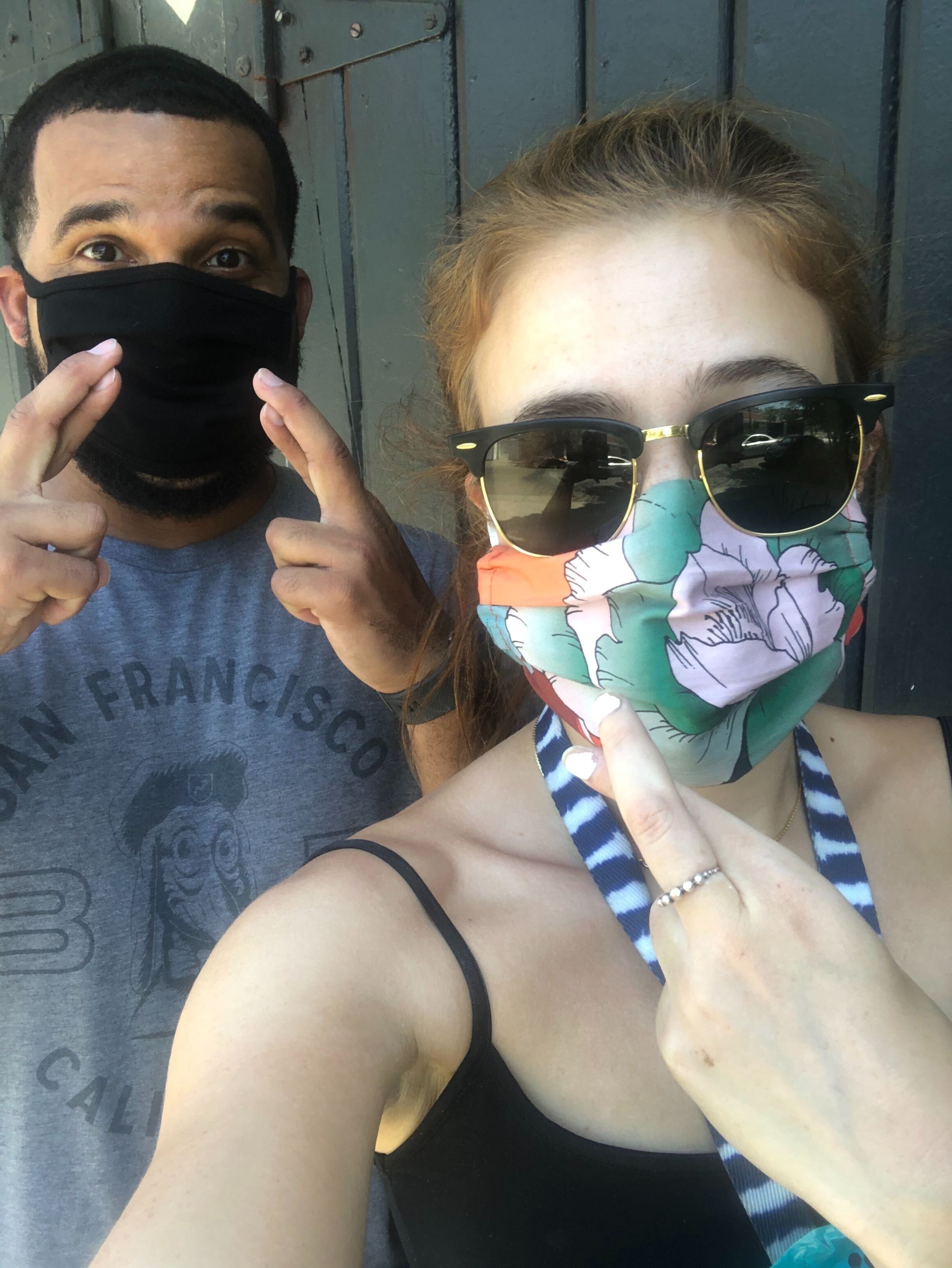 Selfie of Daniella and Troy with masks on, crossing our fingers.