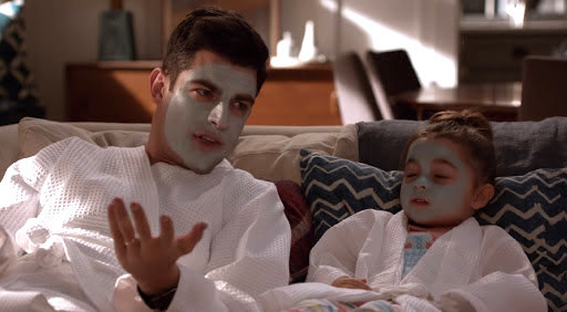 Schmidt applies a face mask with is daughter.