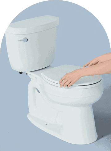 GIF of hand lifting white Tushy bidet on a toilet and turning nozzle to let water out