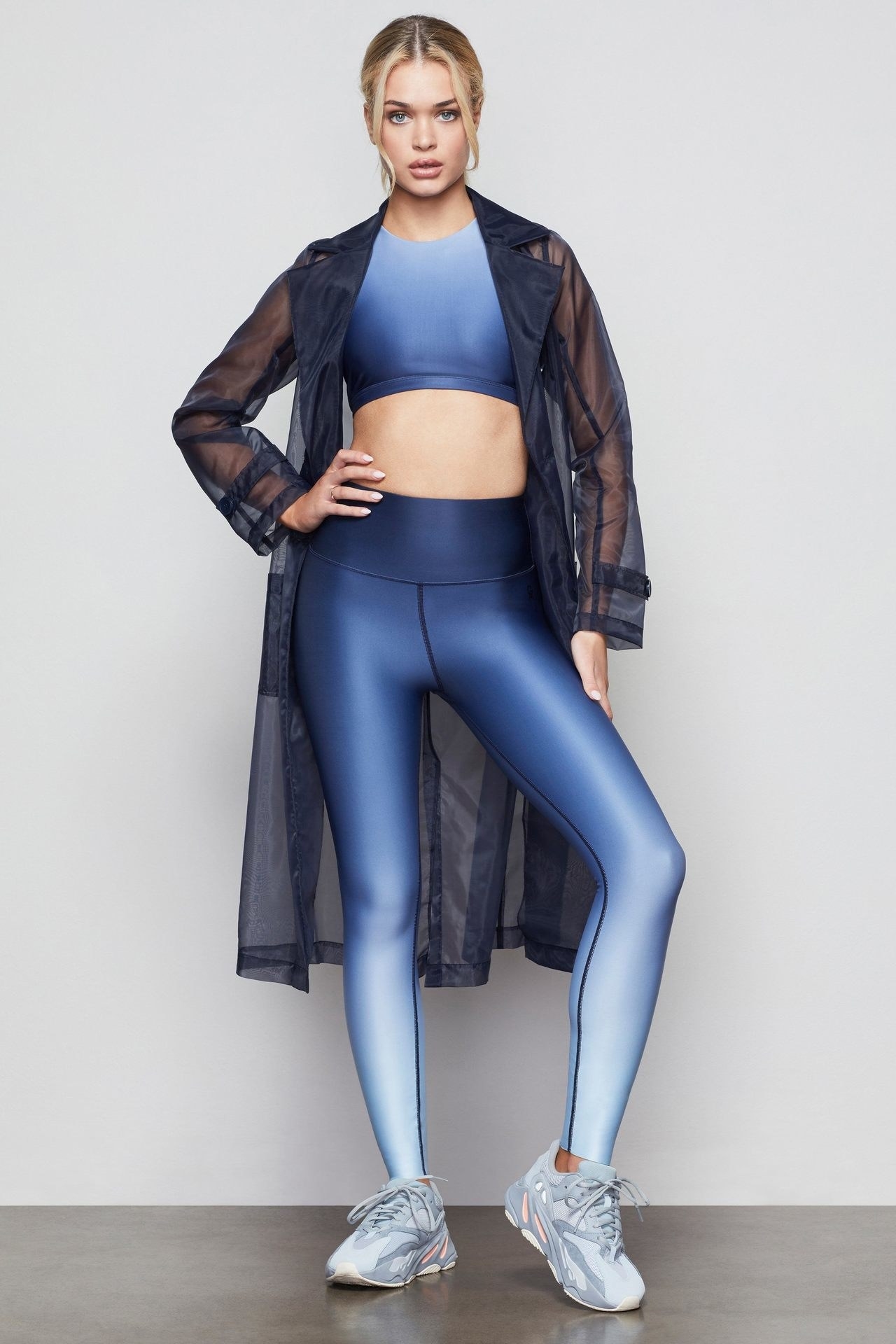 Model wearing the gradient leggings in blue 