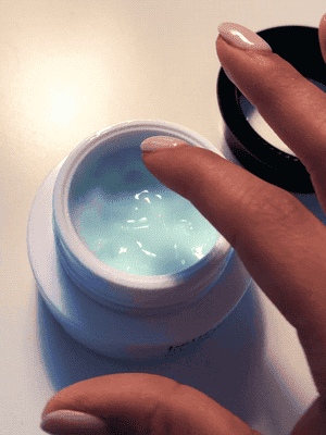 A gif of BuzzFeed Editor, Kayla Suazo dipping her finger into the product to show it's light consistency