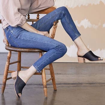 model wearing the shoes with jeans and pink top 