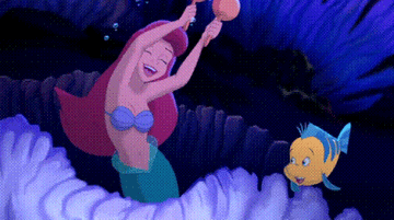 Ariel and Flounder from &quot;The Little Mermaid&quot; dancing underwater