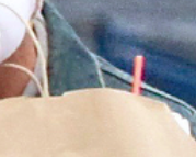 a closeup of a straw sticking out behind the bag