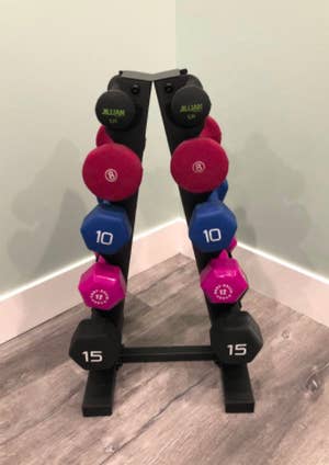 Reviewer uses same dumbbell rack to hold their 10 and 15-pound weights in their home gym