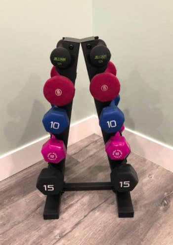 Reviewer uses same dumbbell rack to hold their 10 and 15-pound weights in their home gym