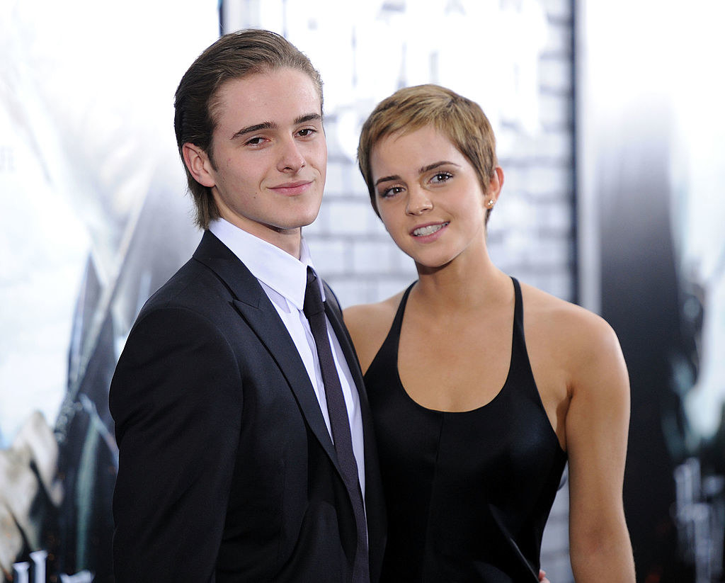 emma and her brother alex on a red carpet