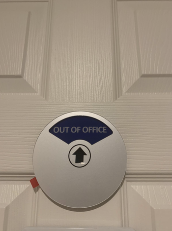 A reviewer photo of the sign stuck to a door with the phrase