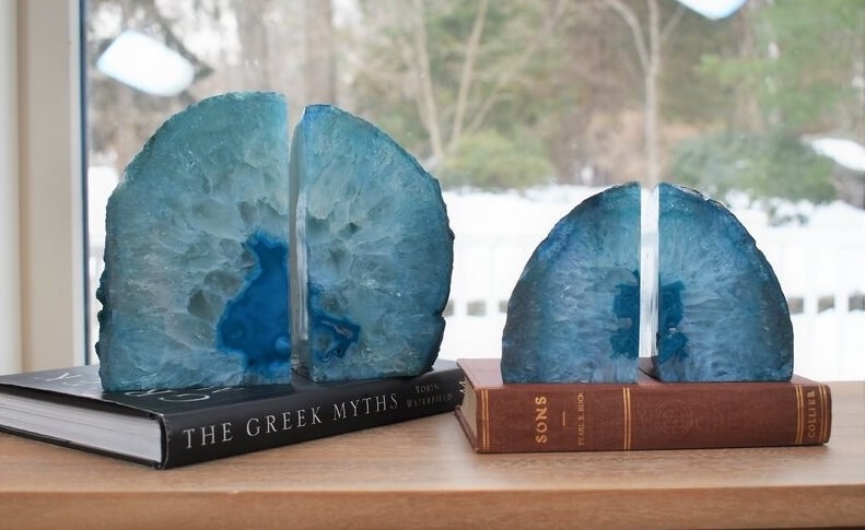 two different sizes of blue crystal-like book ends