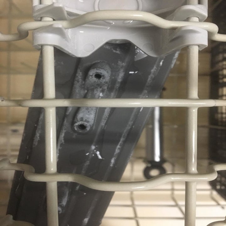 Reviewer photo of some residue on the inside of a dishwasher 