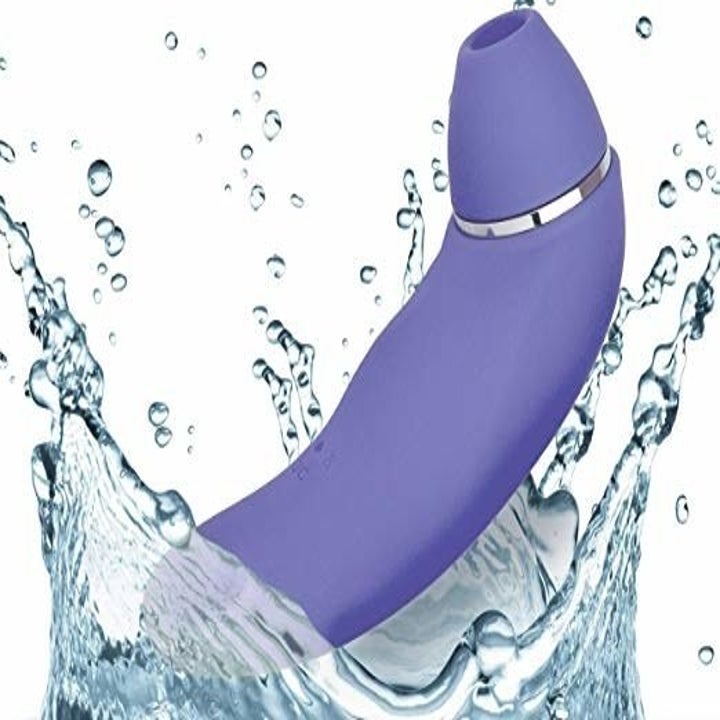 The toy in periwinkle, splashing in water. The vibrating end is thick and can also be used as the toy's handle