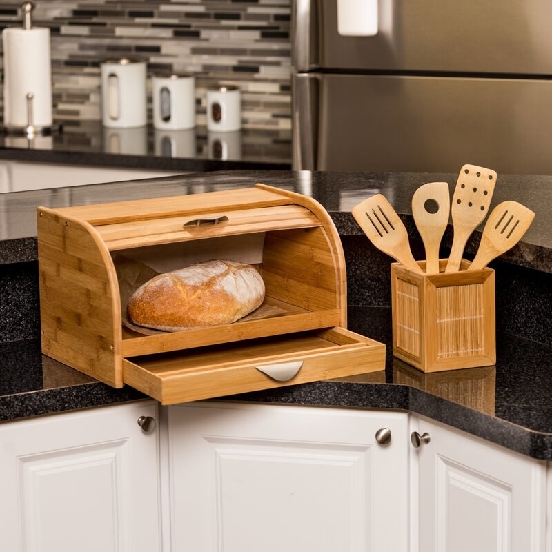 The bread box, featuring a slide-up lid
