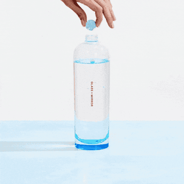 Gif of a tablet being dropped into a bottle and dissolving