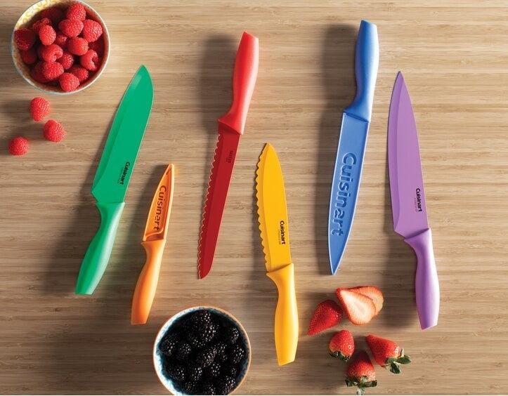 The knives in green, orange, red, yellow, blue, and purple