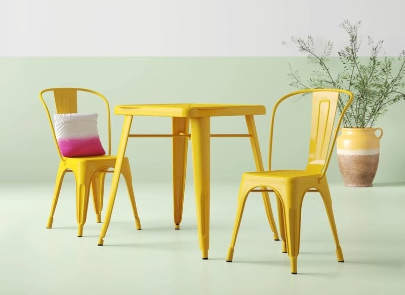 The metal patio set in yellow