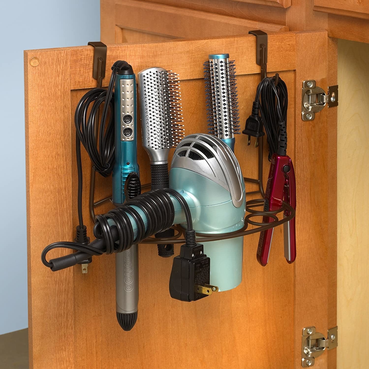 A hot tool station with brushes, a blow dryer, and hot tools inside