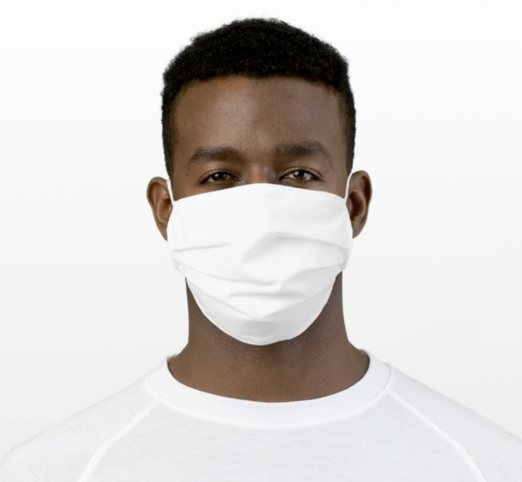 A model wearing a white face mask 