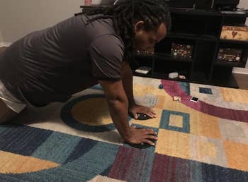 Reviewer uses the same core sliders while doing push-ups in their home