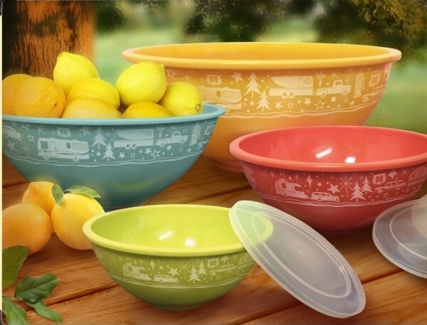 set of four colorful bowls with patern on side of camping items