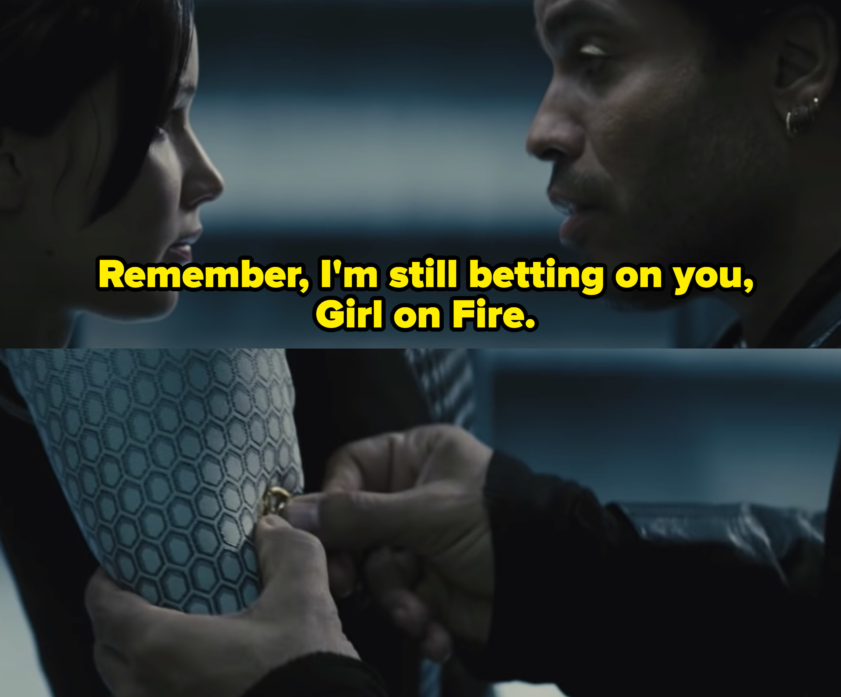 Cinna telling Katniss, &quot;Remember I&#x27;m still betting on you, Girl on Fire,&quot; as he places a mockingjay pin on her sleeve. 