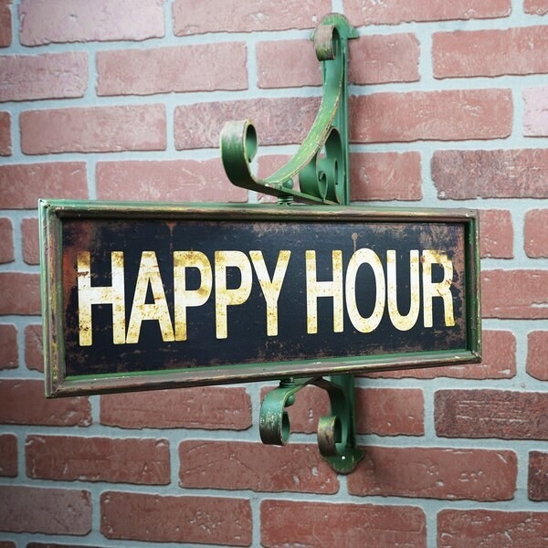 rustic looking sign that says &quot;HAPPY YOUR&quot; mounted on brick wall